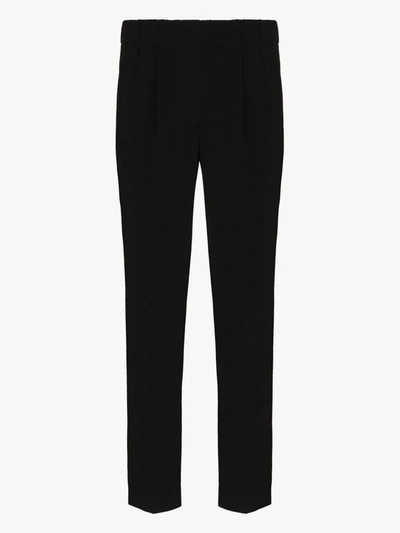 Shop Brunello Cucinelli Slim Tapered Trousers In Black