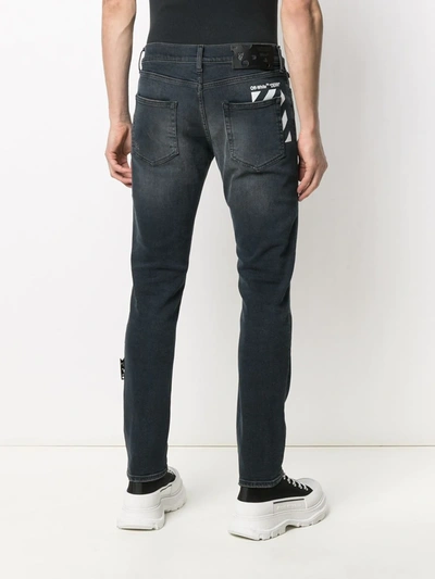 Shop Off-white Ripped Detail Bootcut Jeans In Blue