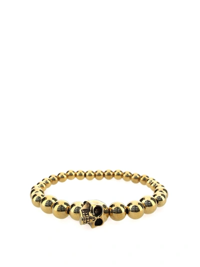 Shop Alexander Mcqueen Skull Bracelet In Gold