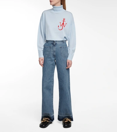 Shop Jw Anderson High-rise Flared Jeans In Blue