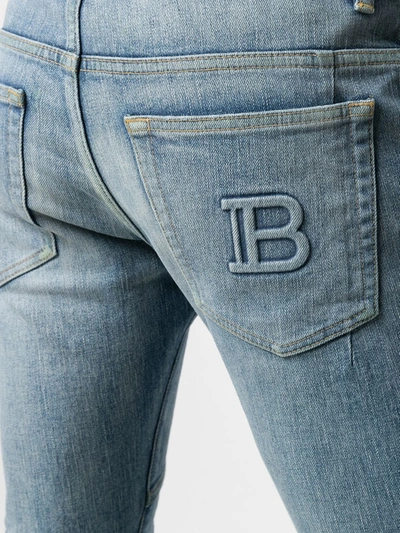 Shop Balmain Logo-embossed Slim-fit Jeans In Blue