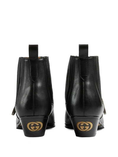 Shop Gucci Buckle Strap Ankle Boots In Black