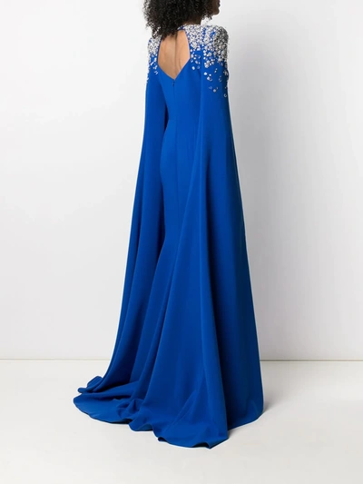 Shop Jenny Packham Embellished-shoulder Cape-style Gown In Blue