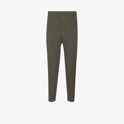 Shop Issey Miyake Tapered Leg Pleated Trousers In Green