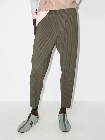 Shop Issey Miyake Tapered Leg Pleated Trousers In Green
