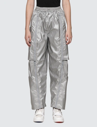 Shop Alch Zip Off Reusable Bag Track Pants In Silver