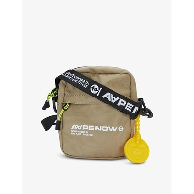 Shop Aape Logo-print Woven Cross-body Bag In Beige