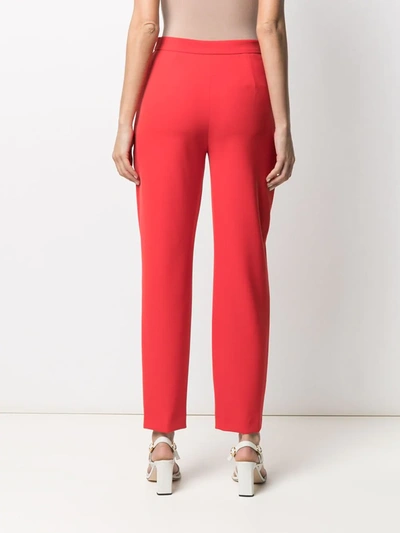 Shop Moschino High-waisted Eyelet-detail Trousers In Red