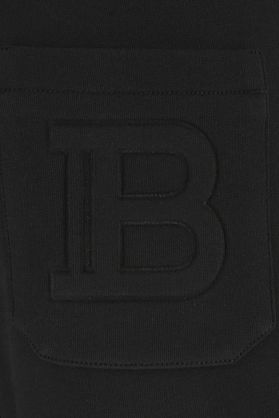 Shop Balmain Embossed Logo Sweatpants In Black