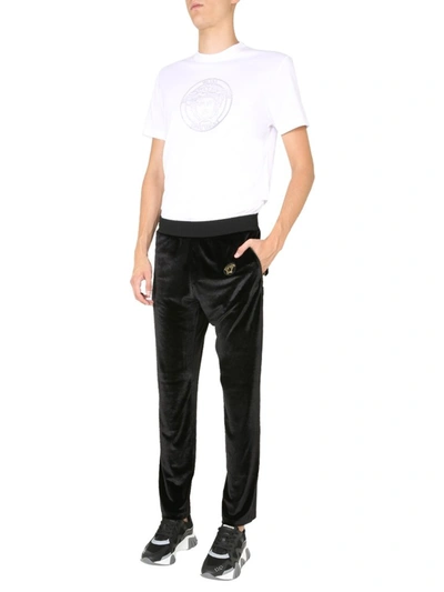 Shop Versace Medusa Crest Velvet Trousers In Black