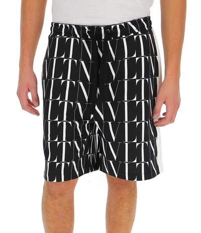 Shop Valentino Vltn All Over Logo Printed Shorts In Multi