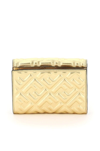 Shop Fendi Logo Embossed Medium Baguette Wallet In Gold