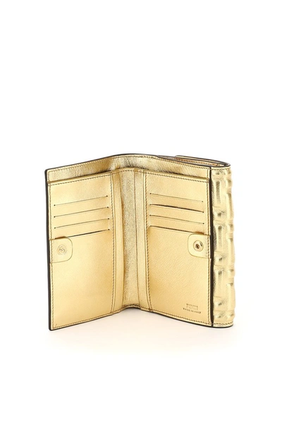 Shop Fendi Logo Embossed Medium Baguette Wallet In Gold