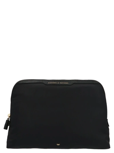 Shop Anya Hindmarch Lotions And Potions Clutch In Black