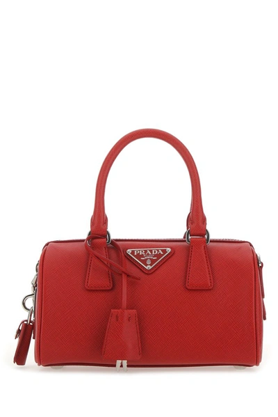 Shop Prada Logo Plaque Saffiano Top Handle Bag In Red