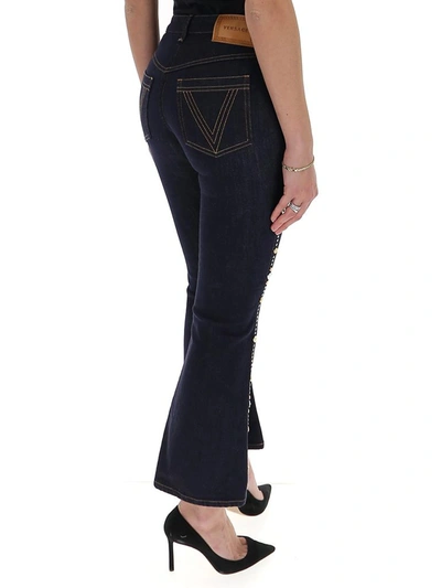 Shop Versace Embellished Cropped Flared Jeans In Blue