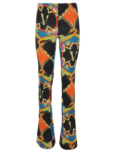 Shop Versace Graphic Printed Flared Pants In Multi