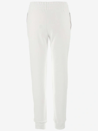 Shop Moschino Milano Logo Print Track Pants In White