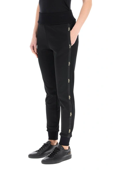 Shop Fendi Logo Side Striped Track Pants In Black