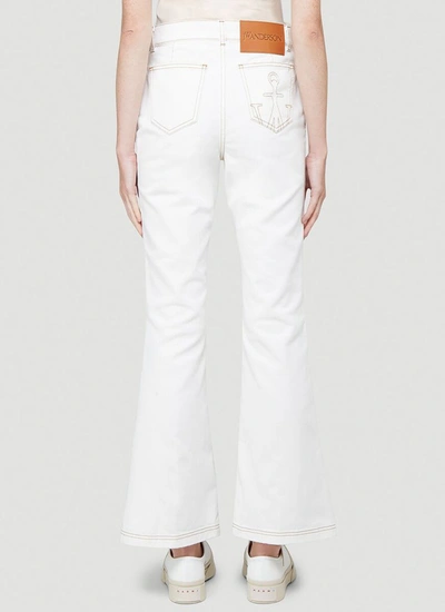 Shop Jw Anderson Boot Cut Jeans In White