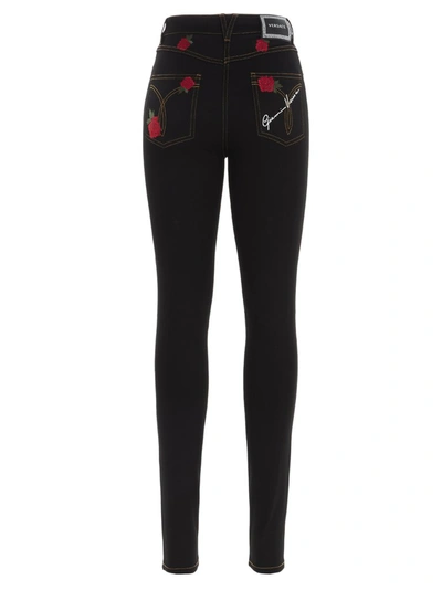 Shop Versace Rose Embroidered Skinny Leg Jeans In Black