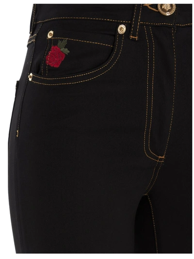 Shop Versace Rose Embroidered Skinny Leg Jeans In Black