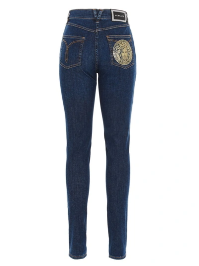 Shop Versace Medusa Print Jeans In Blue