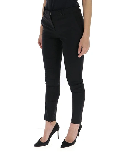 Shop Versace Skinny Leg Trousers In Black