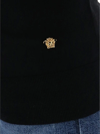 Shop Versace Medusa Pin Detailed Knit Jumper In Black