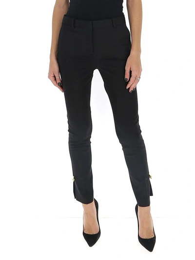 Shop Versace Safety Pin Embellished Trousers In Black