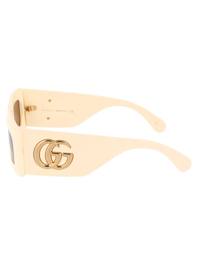 Shop Gucci Eyewear Rectangular Frame Sunglasses In Beige