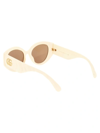 Shop Gucci Eyewear Cat Eye Sunglasses In Beige