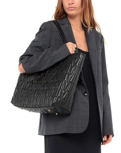 Moschino Handbags In Black