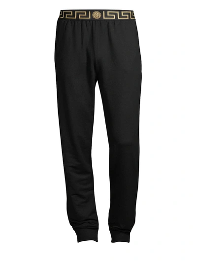 Shop Versace Greca Border Gym Trousers In Black Gold