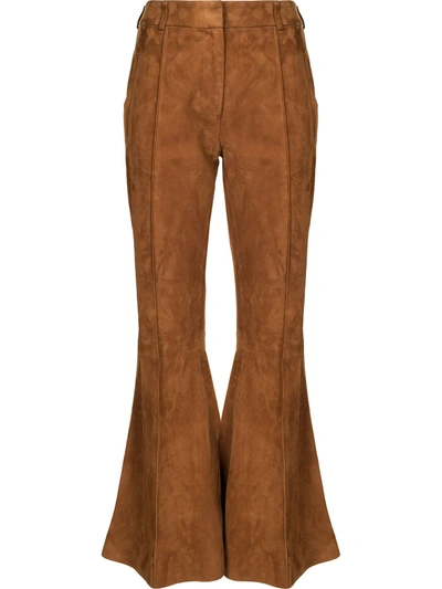 Shop Khaite Flared-leg Trousers In Brown