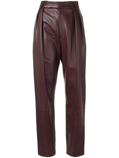 Shop Khaite Magdeline Tapered-leg Leather Trousers In Red