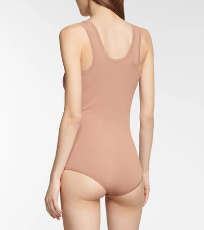 Shop Alaïa Stretch-knit Bodysuit In Beige