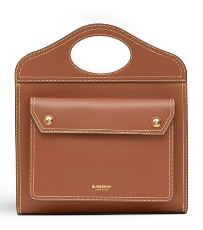 Shop Burberry Mini Leather Pocket Top-handle Bag In Brown