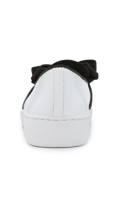 Shop Michael Kors Val Bow Sneakers In Optic White