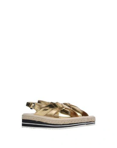 Shop Prada Sandals In Gold