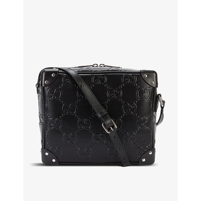 Shop Gucci Gg-embossed Leather Messenger Bag