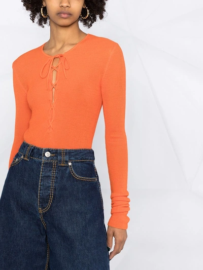 Shop Ganni Lace-up Merino Top In Orange