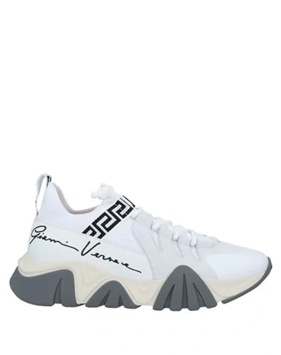 Shop Versace Sneakers In White