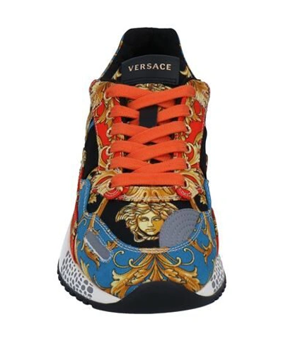 Shop Versace Sneakers In Orange