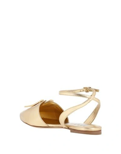 Shop Moschino Ballet Flats In Gold