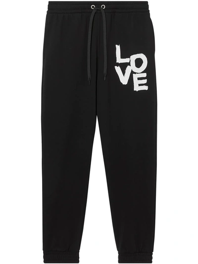 Shop Burberry Love-print Track Pants In Black