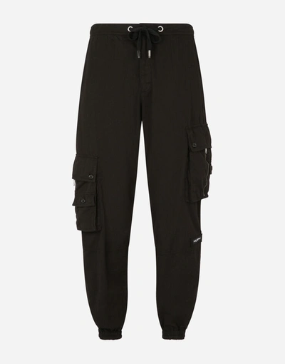 Shop Dolce & Gabbana Garment-dyed Stretch Cotton Jogging Pants In Black