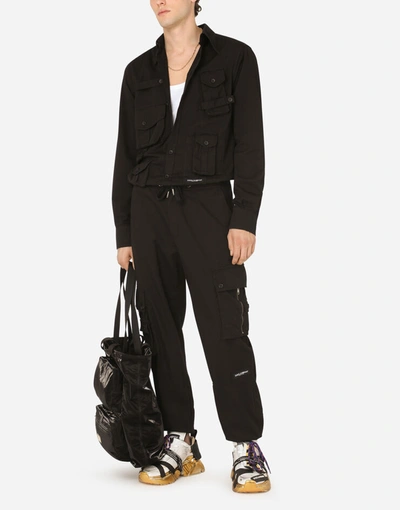 Shop Dolce & Gabbana Garment-dyed Stretch Cotton Jogging Pants In Black