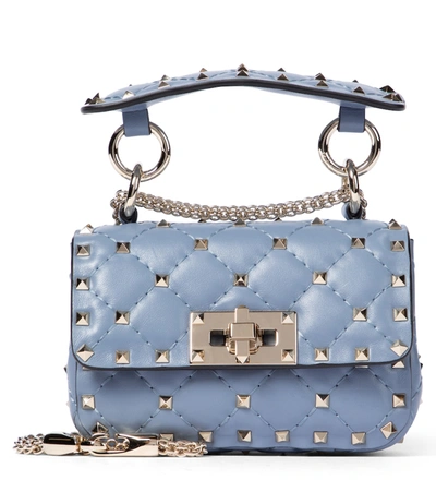 Shop Valentino Rockstud Spike Micro Leather Crossbody Bag In Blue