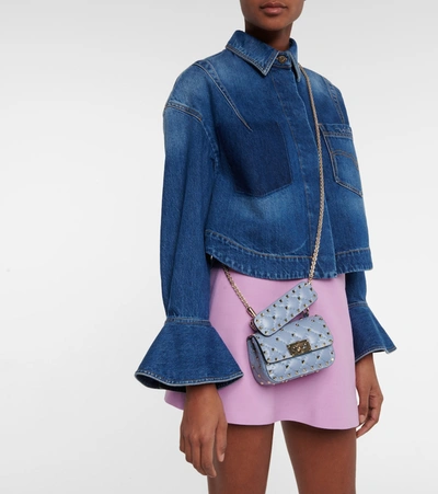 Shop Valentino Rockstud Spike Micro Leather Crossbody Bag In Blue